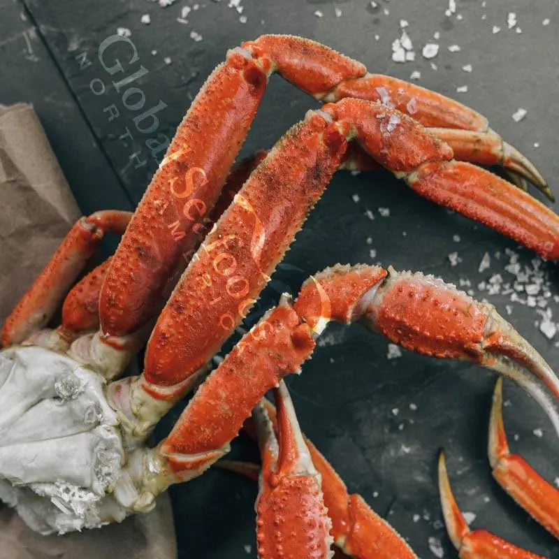 A selection of large and flavorful Snow Crab Clusters, including Bairdi and Opilio varieties, meticulously prepared and flash-frozen for freshness