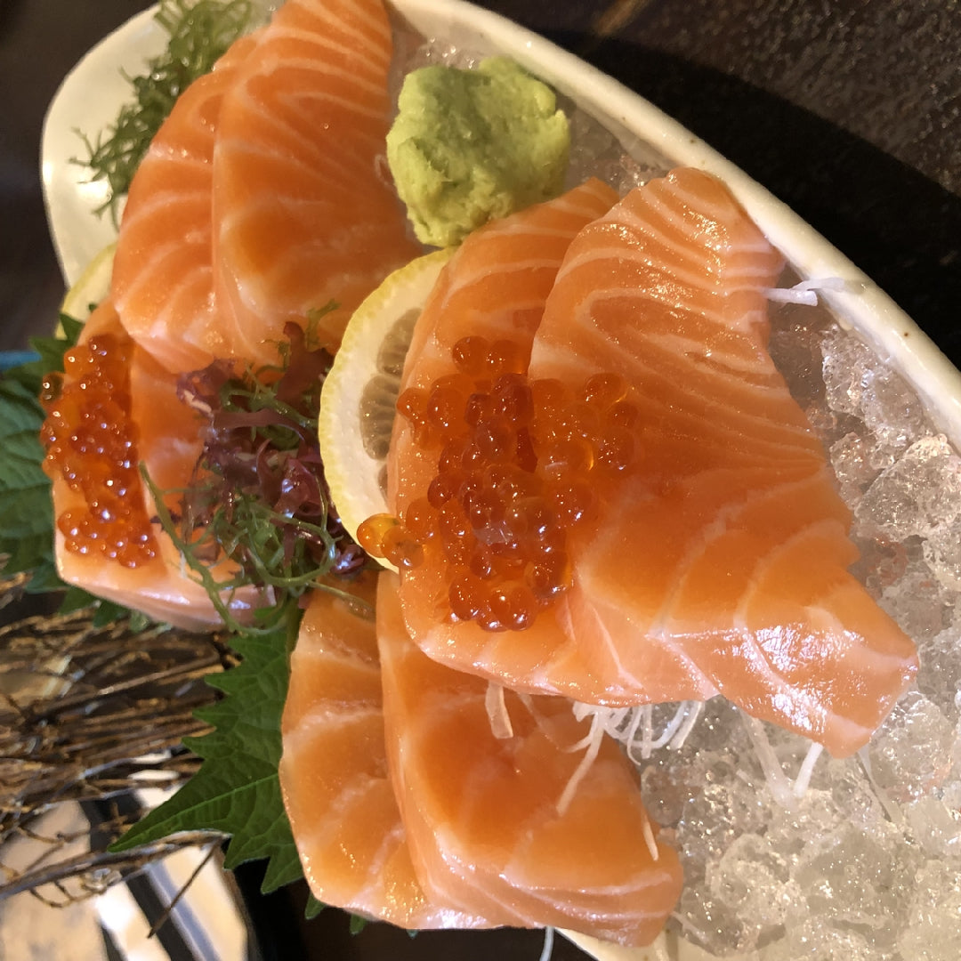 Creamy Ora King Salmon risotto plated in a wide bowl garnished with fresh dill and lemon zest