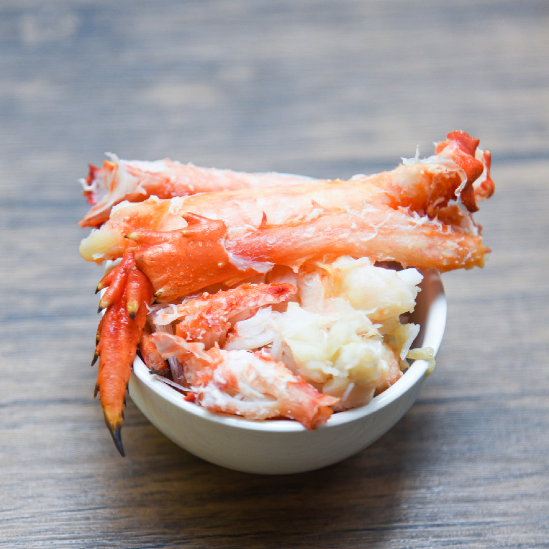 Jumbo Alaskan king crab legs on ice ready for cooking