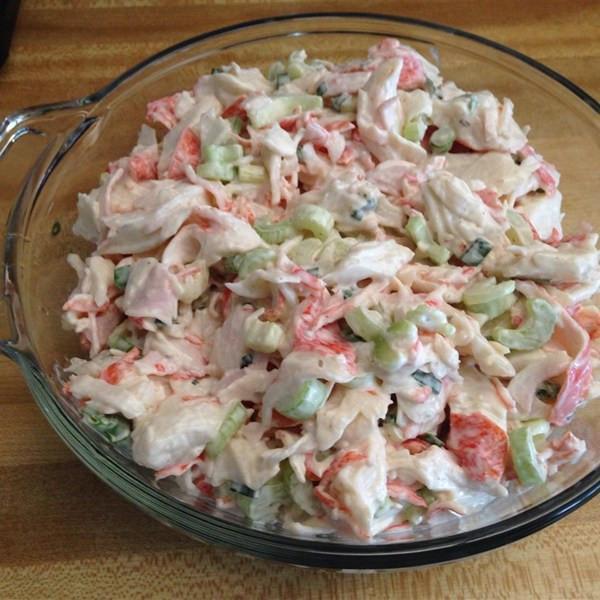 Fresh crab salad with lump crab meat, celery, and chives served on mixed greens with avocado and cherry tomatoes