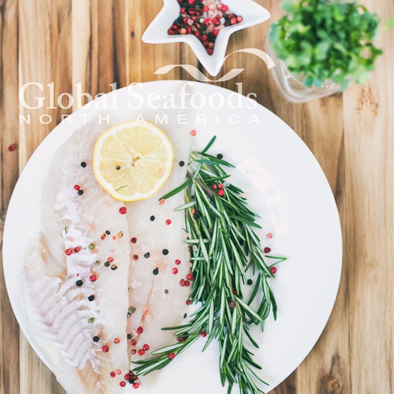 Rougheye Rockfish fillets with large flaky texture on a white surface, ready for cooking