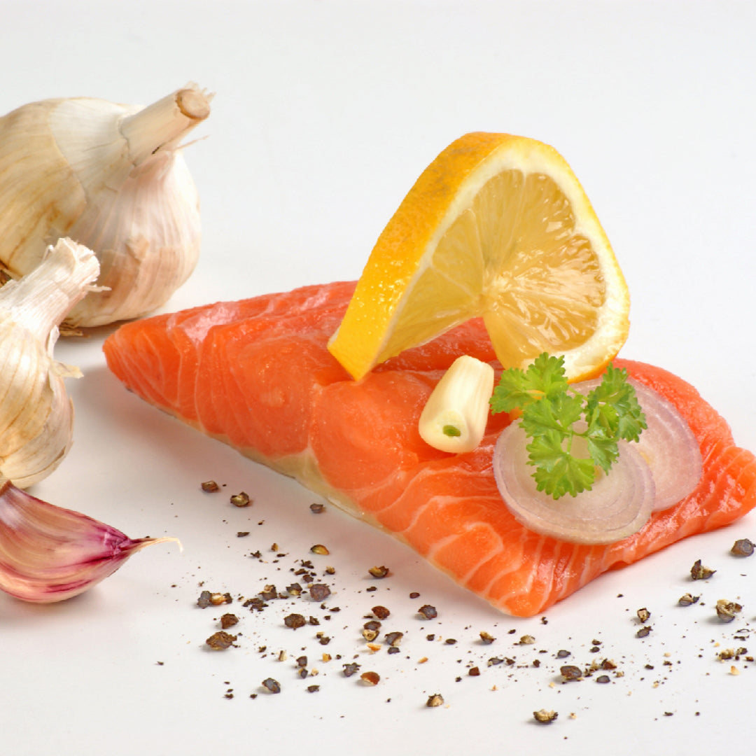 Ora King Salmon fillet with vibrant orange marbling on a clean surface representing sustainable premium seafood