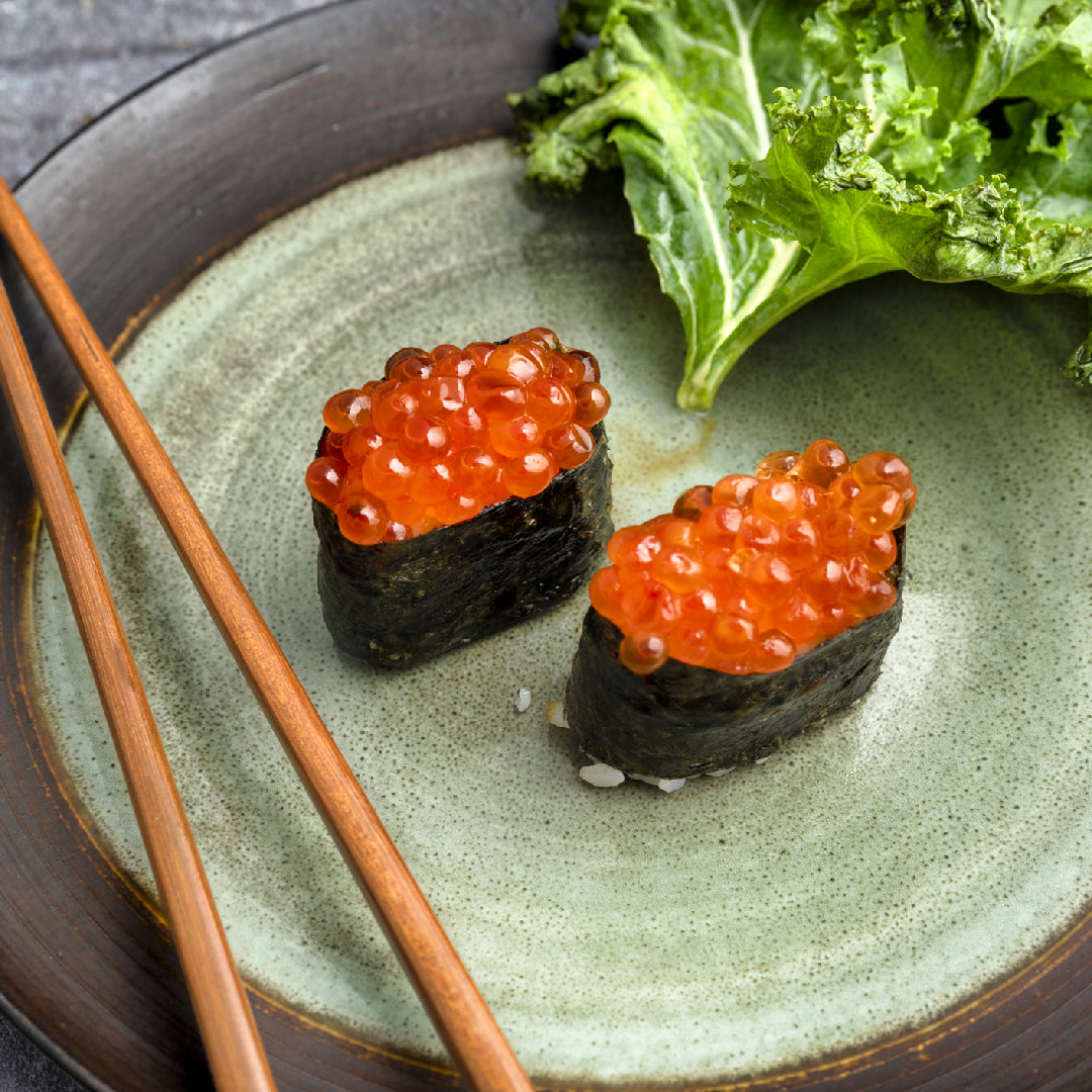 Bowl of vibrant orange salmon roe ikura alongside whole-grain toast with avocado, illustrating a menopause-supportive meal