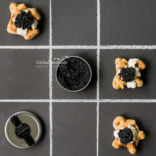 Kaluga caviar pearls in a glass bowl showcasing their large dark glossy eggs and luxurious texture