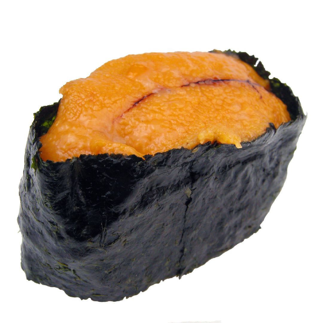 Fresh sea urchin (uni) gonads arranged on a wooden board, showing the bright golden-orange color and creamy texture of premium Grade A uni