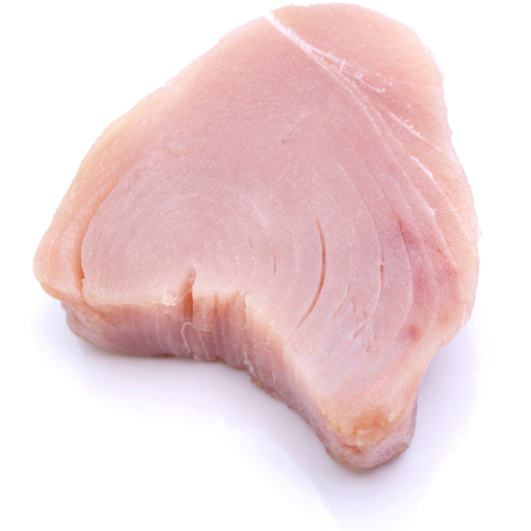 Fresh albacore tuna sliced for sushi and sashimi