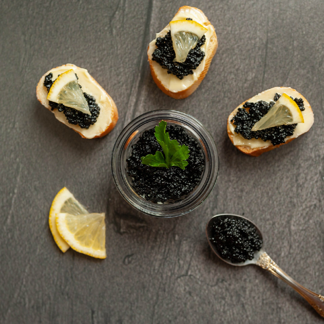 Kaluga caviar served with chilled vodka and blini on crushed ice