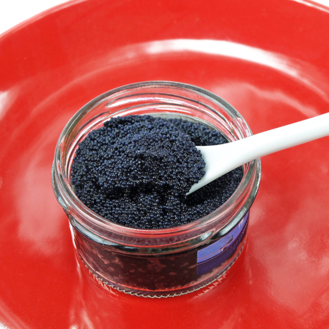 Premium Beluga caviar pearls in a luxury serving dish