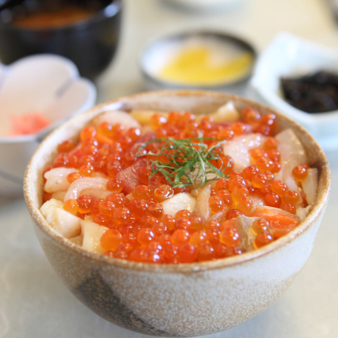 Ikura hibachi dish with salmon roe and grilled seafood