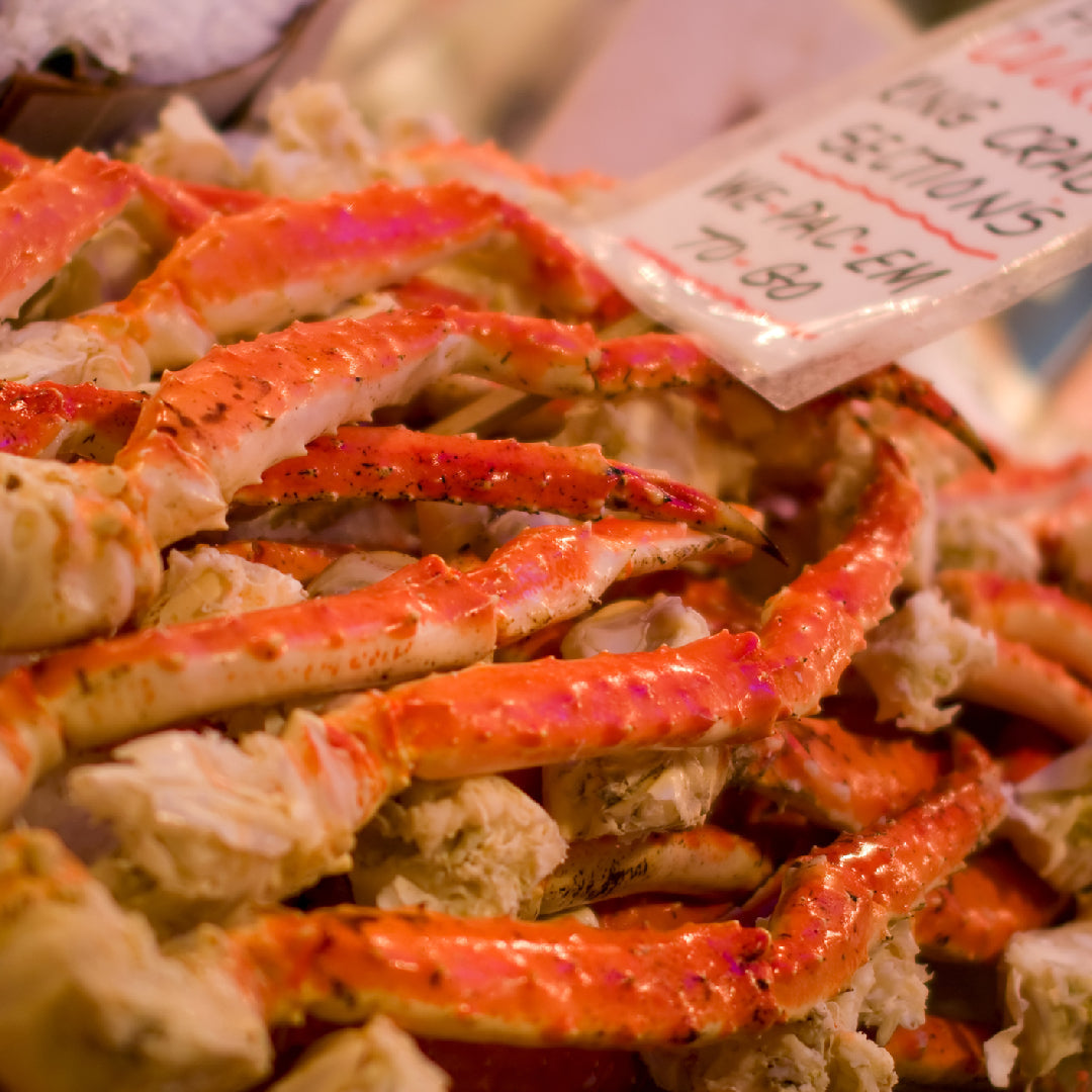 Elegant crab claw dishes for a romantic dinner including garlic butter crab claws and crab risotto plated on fine dinnerware with candlelight