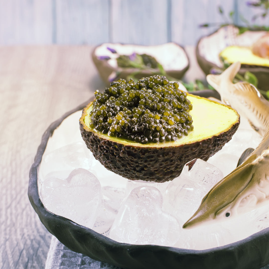 Selection of Osetra caviar varieties on ice, showcasing shades from deep brown to golden, epitomizing gourmet luxury and the rich diversity of flavors