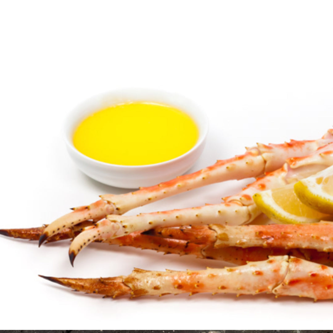 Homemade crab butter sauce drizzled over Alaskan king crab legs