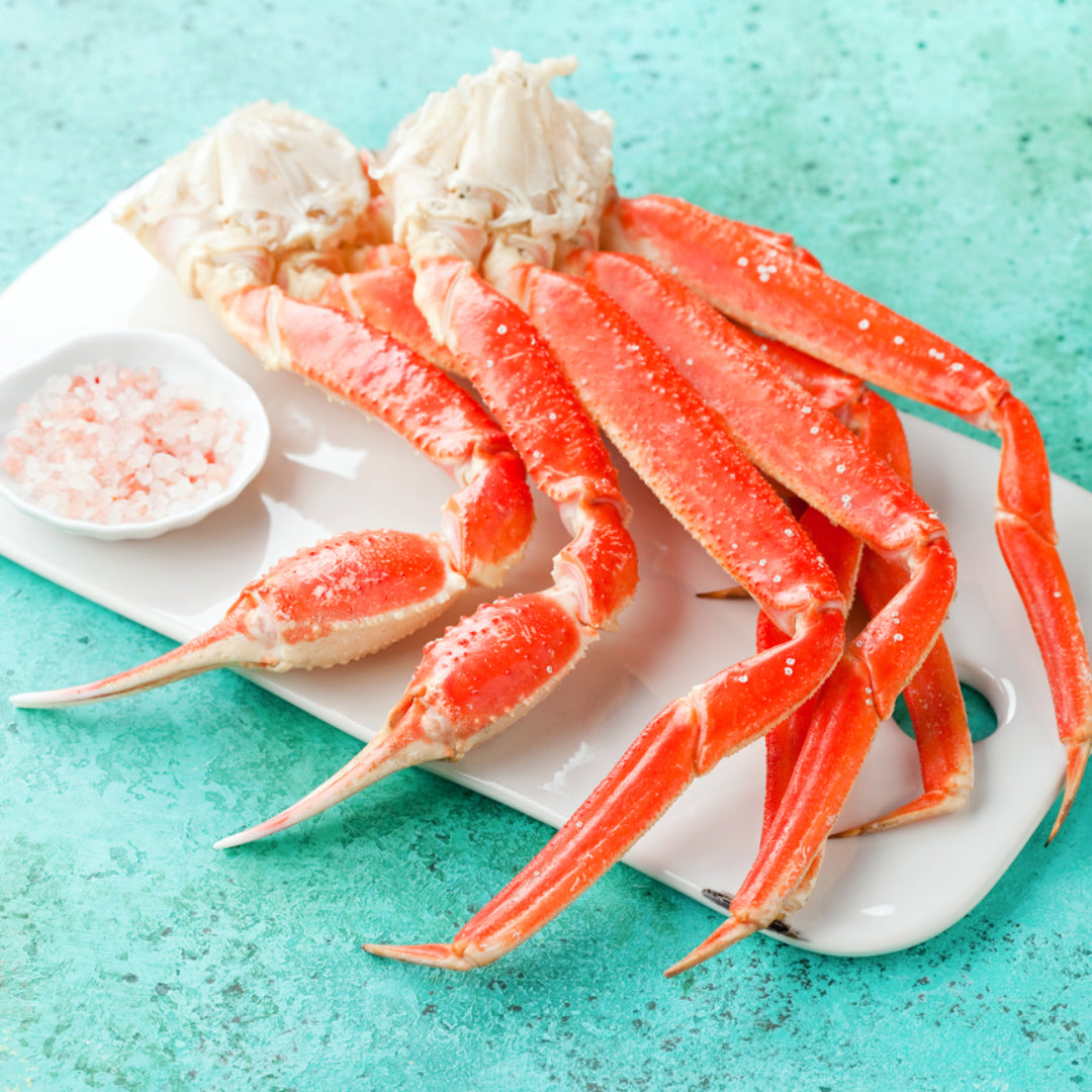 Snow crab legs on a white plate