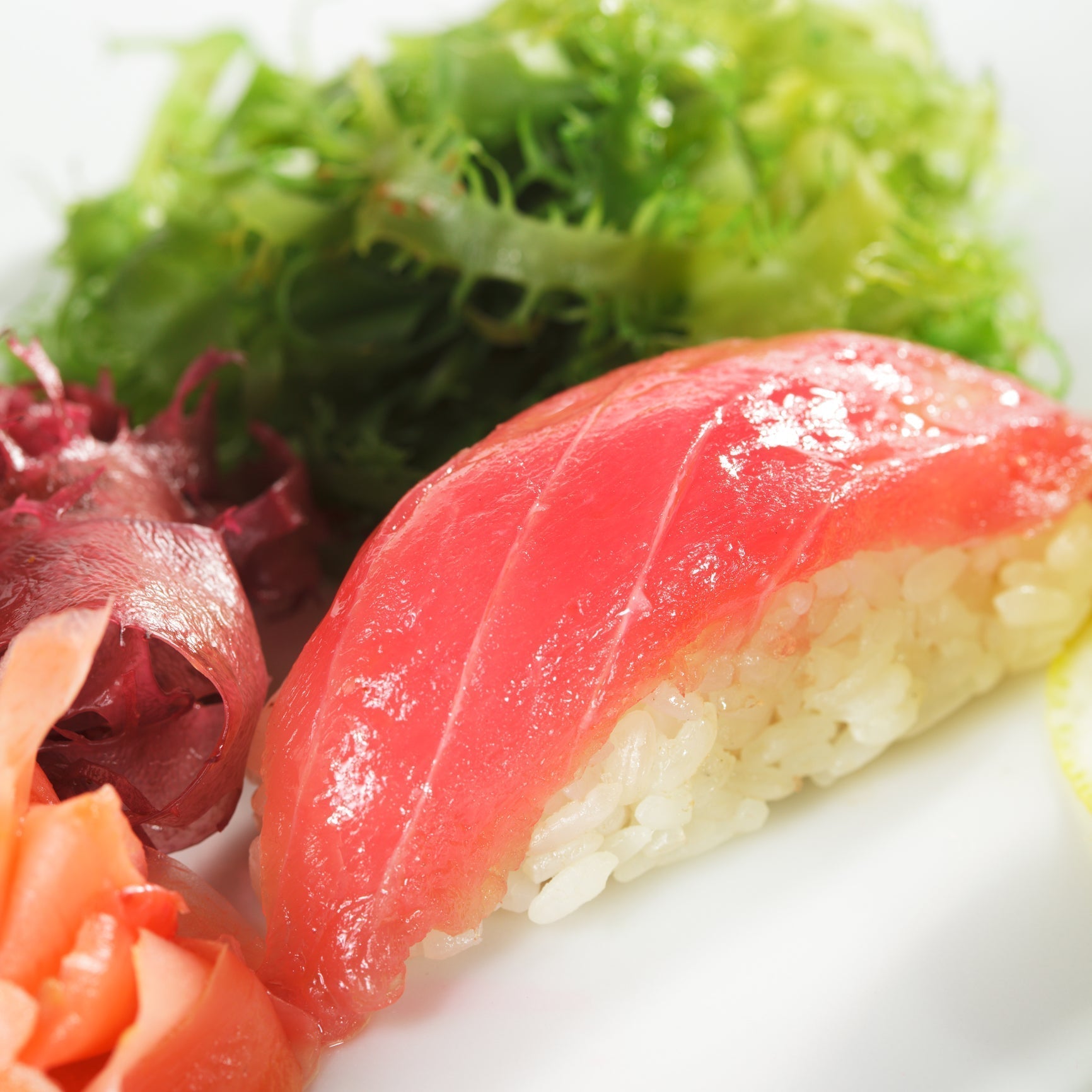 Sliced ahi tuna steak served on a bed of white rice