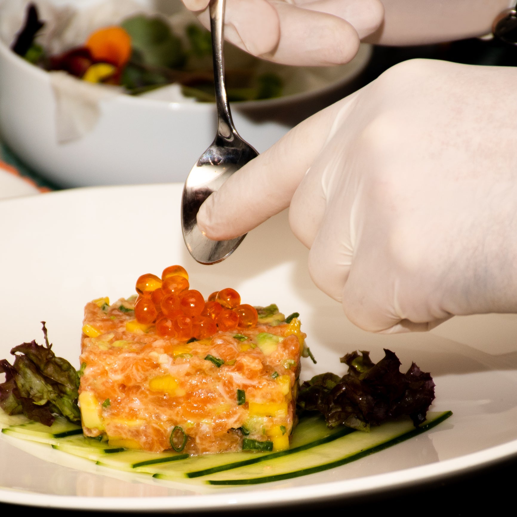Assorted elegant salmon red caviar appetizers on a serving platter, ready to impress guests at a luxury gathering