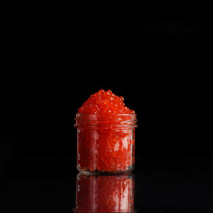 Fresh salmon roe in a glass jar