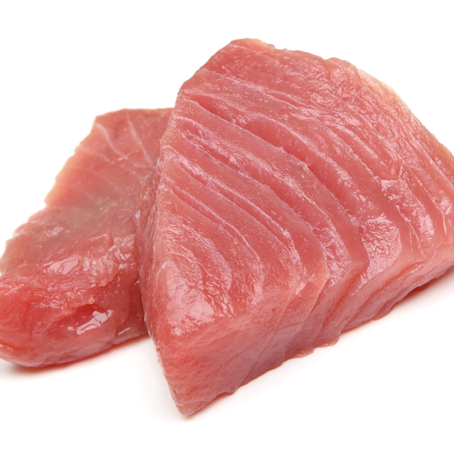 Yellowfin tuna (Ahi tuna) – fresh sushi-grade Ahi tuna steaks showing the characteristic deep red lean flesh, firm texture, and mild flavor ideal for searing, grilling, sushi, sashimi, and poke bowls