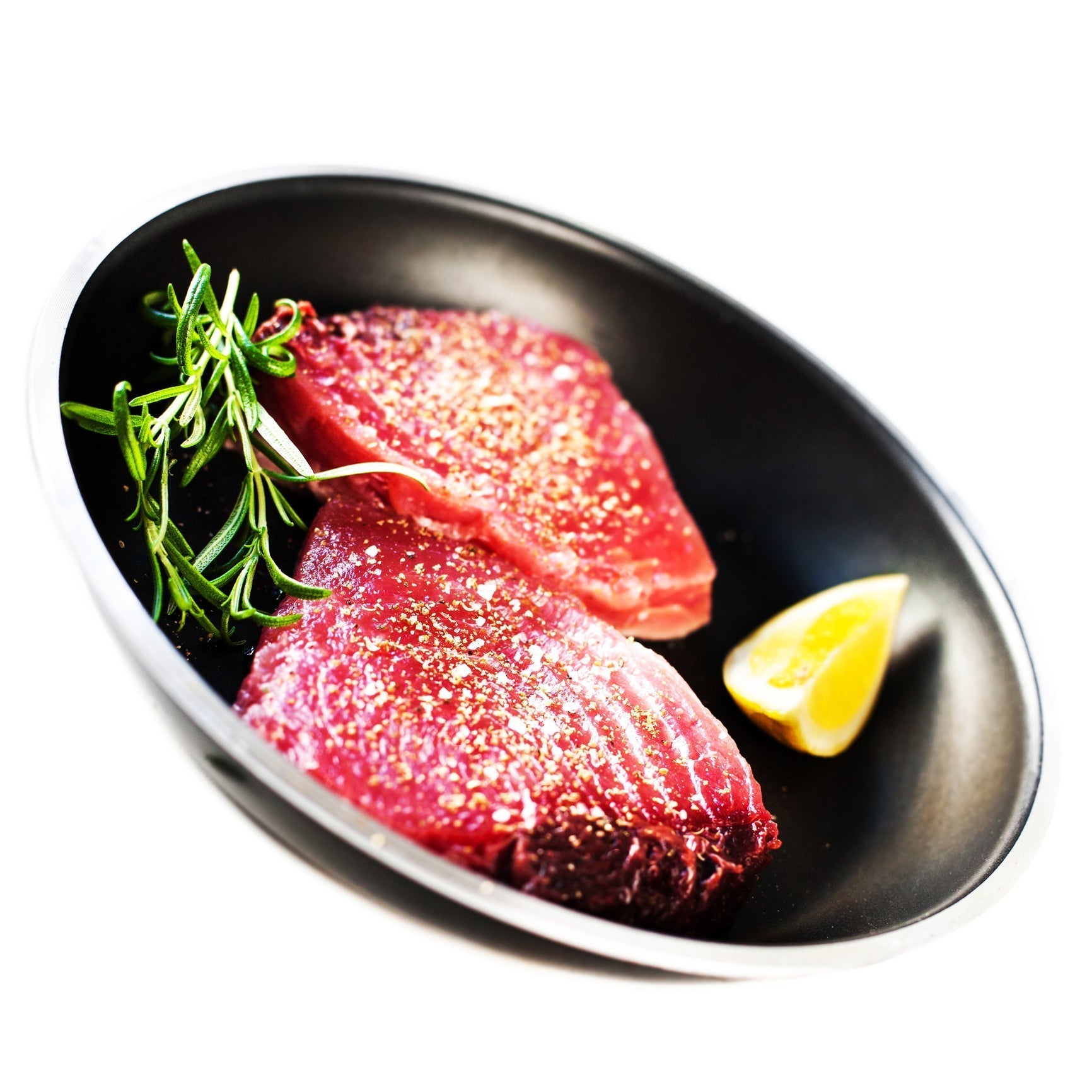 Seared Ahi tuna appetizer slices with avocado, radishes, cilantro, and soy-lime dressing on a serving platter
