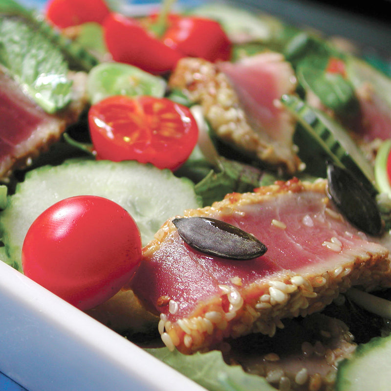 Smoked tuna salad with mixed greens, cherry tomatoes, and lemon dressing