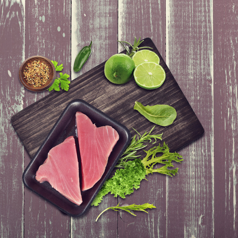 Gourmet smoked tuna sandwich on toasted sourdough with avocado, pickled onions, and lemon-garlic aioli