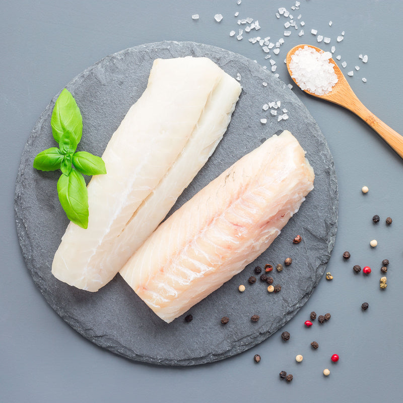 Pan-seared lingcod fillet served with lemon and herbs for a Sunday dinner