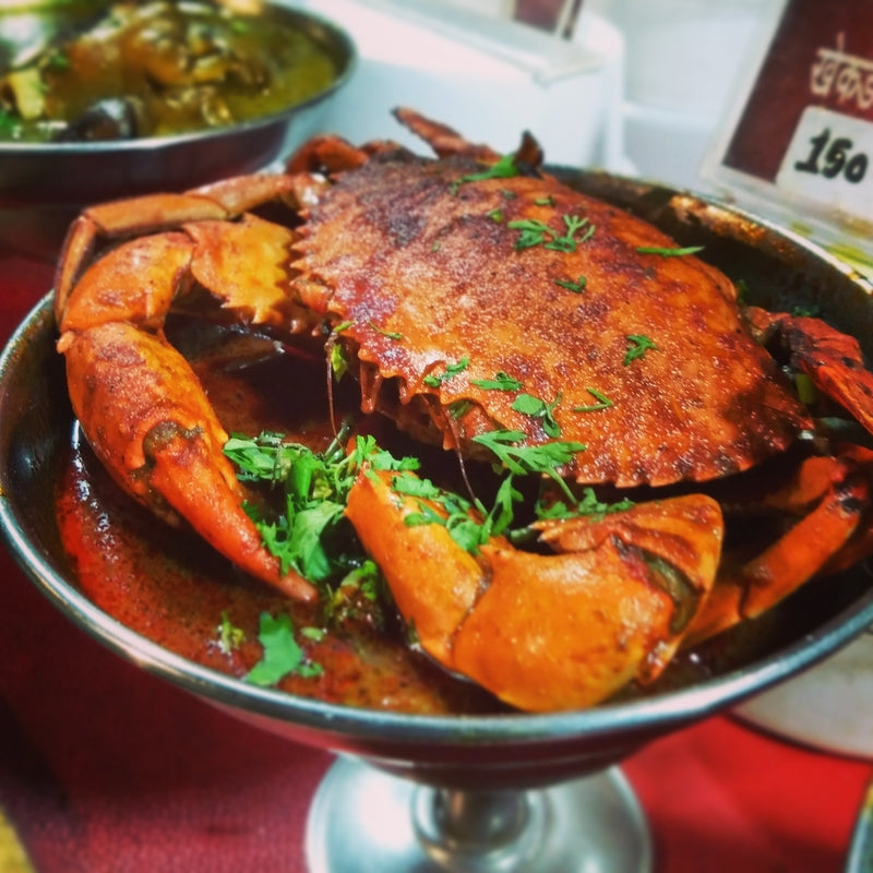 Spicy Dungeness crab stir-fried with garlic, ginger, and chili flakes served with steamed rice