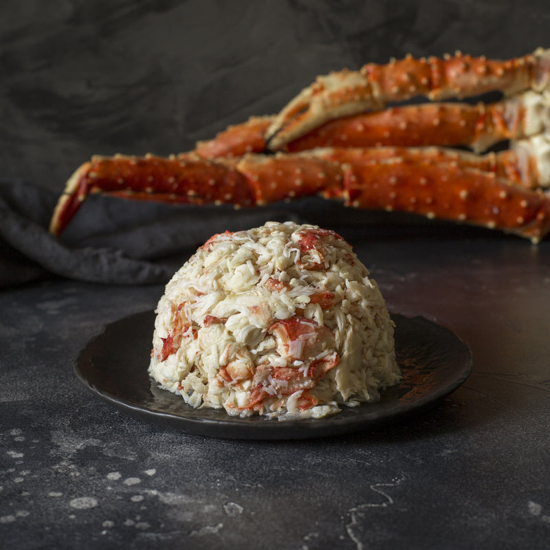Red crab caught in a crab net at low tide on a rocky Pacific coast shoreline