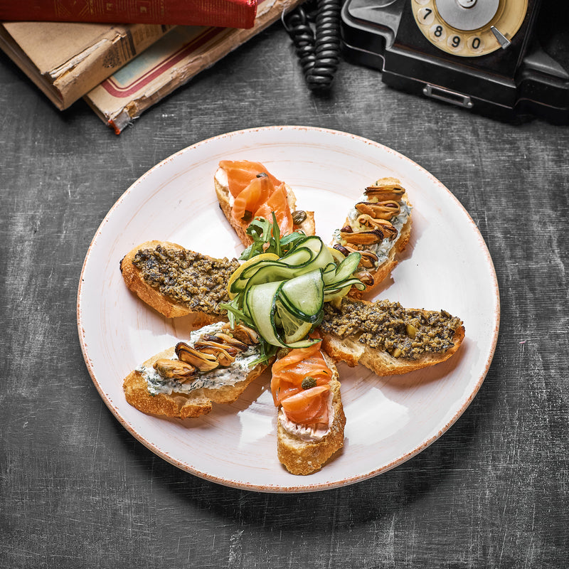 Dungeness crab toast on toasted sourdough with fresh parsley and lemon wedges