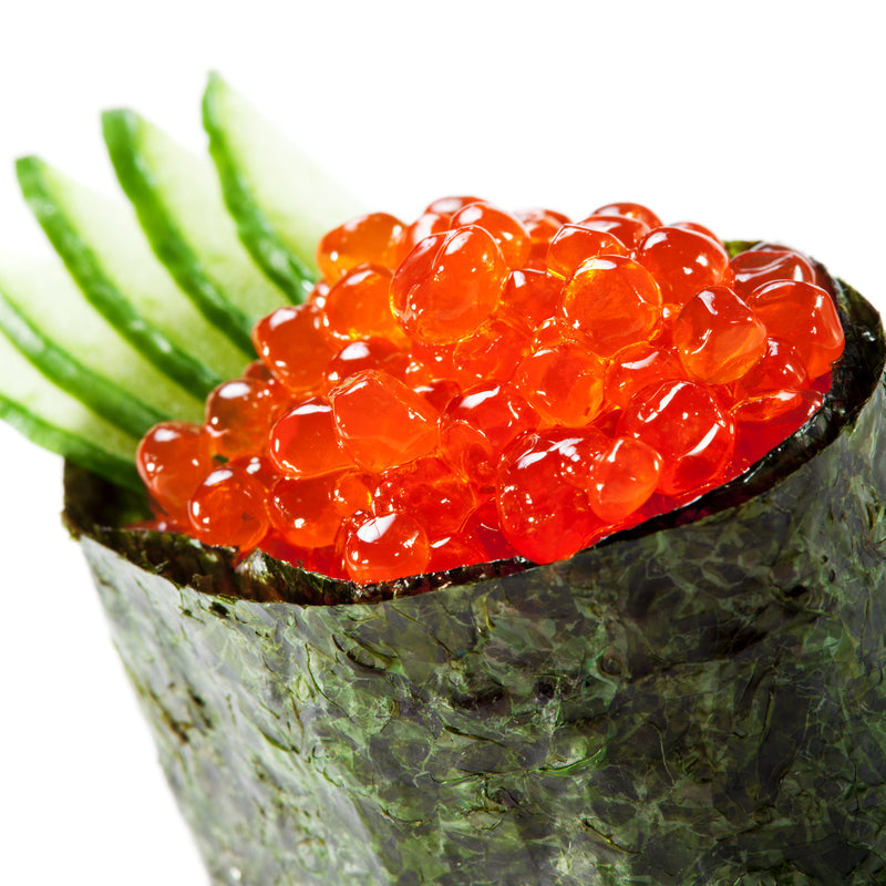 Assorted red caviar varieties – Chum, Sockeye, Coho, and Trout roe in glass jars for comparison