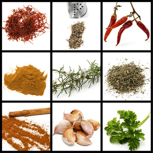 Assorted collection of fish seasoning spices, including dill, paprika, lemon pepper, and garlic powder, arranged around fresh fish fillets