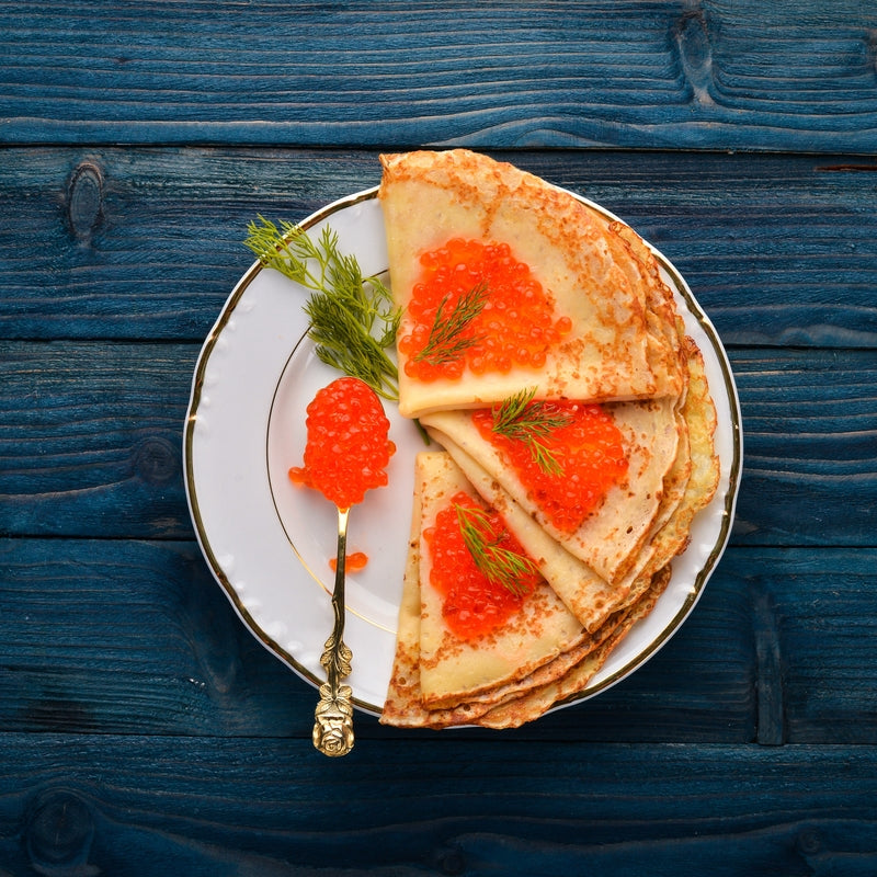 Ikura (salmon roe) paired with lemon sorbet and fresh mango -- a sweet-savory flavor combination using premium salmon roe