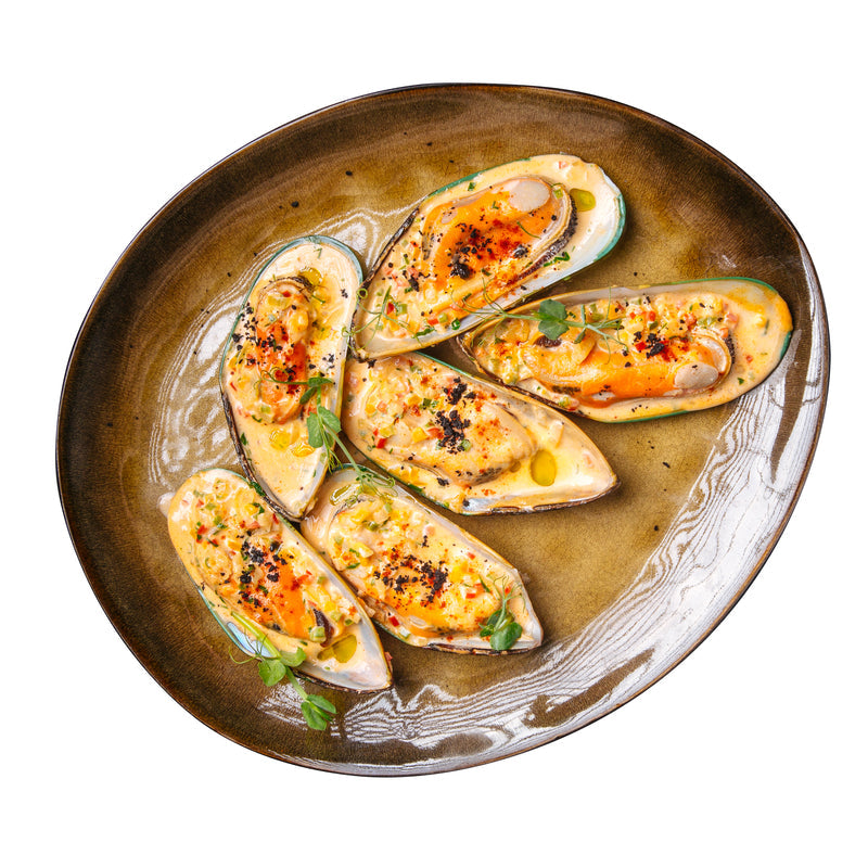 Fresh mussels being prepared for cooking