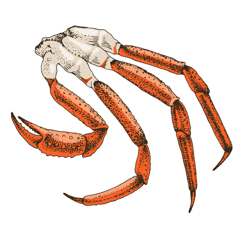 Snow crab legs on a plate with lemon wedges representing a low-carb high-protein seafood meal