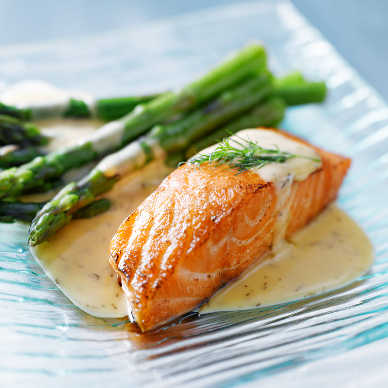 Dry-aged steelhead salmon fillet after 10 days showing firm, glossy flesh and dried exterior ready for searing