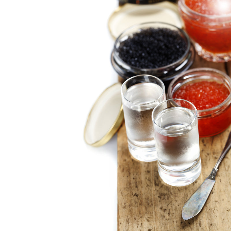 Paddlefish caviar in an open tin with a mother-of-pearl spoon