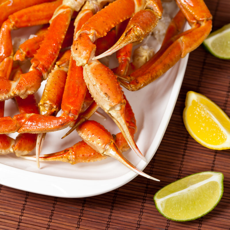 Snow crab boil with corn, potatoes, and sausage in a seasoned broth