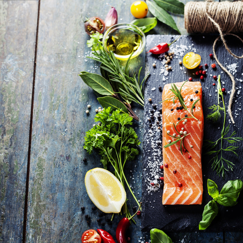 Overhead view of a fresh seafood market display with fish and shellfish on ice