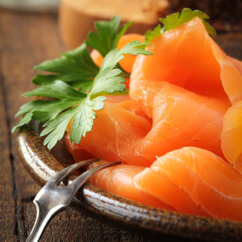 Hot-smoked salmon fillet — the safer choice during pregnancy compared to cold-smoked salmon (lox), which carries a Listeria risk due to its curing-only preparation without heat