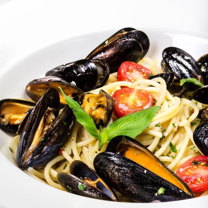 Fresh mussels on the half shell, the culinary jewel of the sea