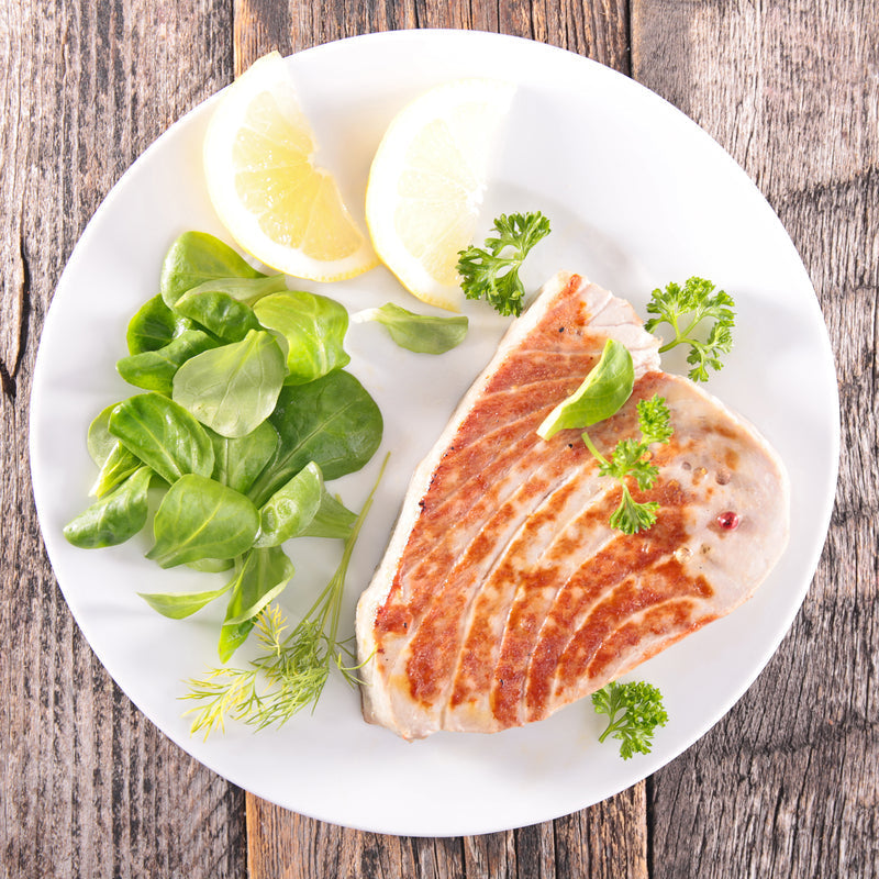Creamy smoked tuna risotto garnished with fresh parsley and Parmesan