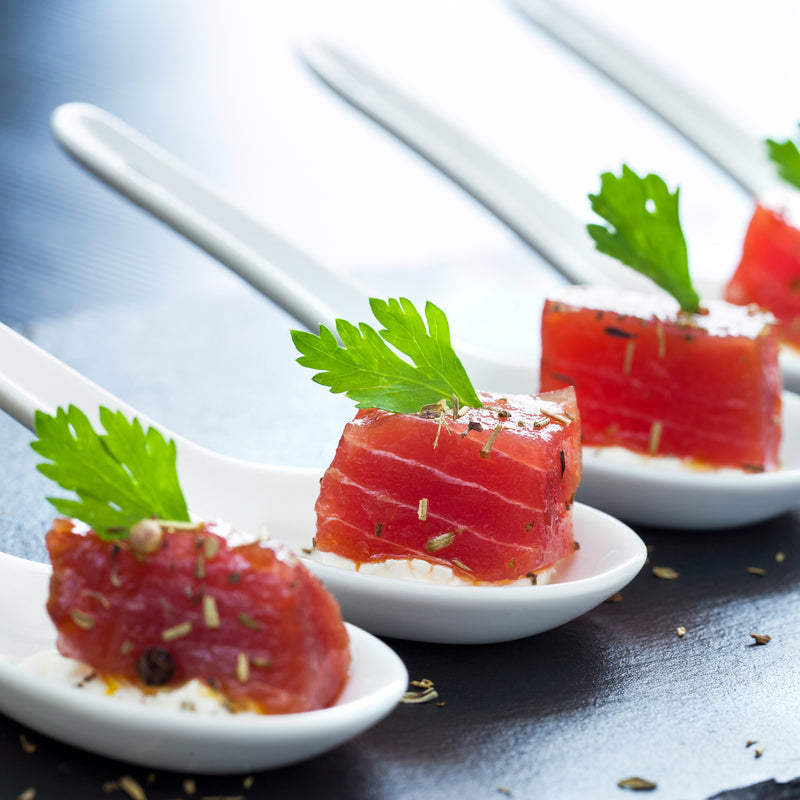 Golden baked smoked tuna stuffed mushrooms garnished with fresh herbs
