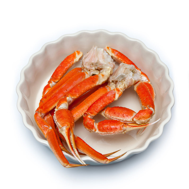 Five must-try red crab dishes including Dungeness crab boil, king crab legs, and crab cakes