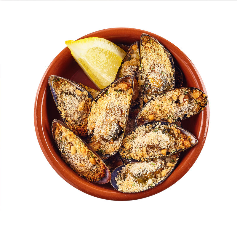 Mussels steamed in white wine and garlic — a dish with roots in ancient Roman aquaculture and medieval European coastal traditions