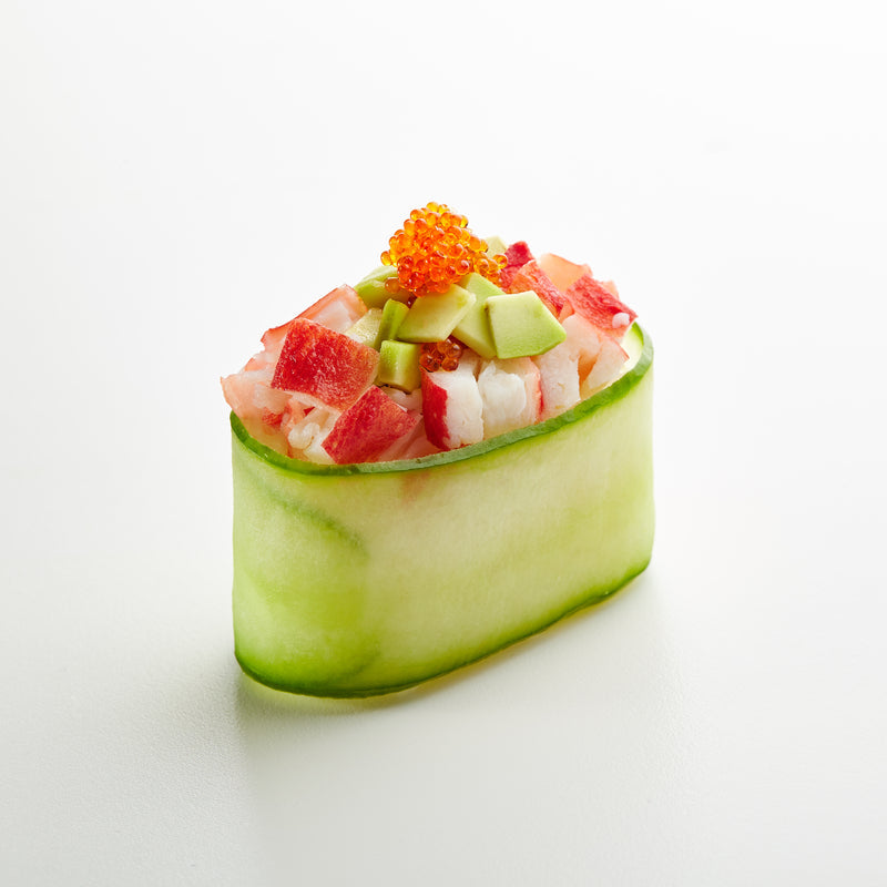 Vibrant cocktail caviar pearls garnishing a champagne glass and seafood appetizers on a party platter