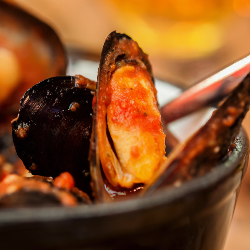 Fresh mussels in a bowl representing the global sustainable seafood trend