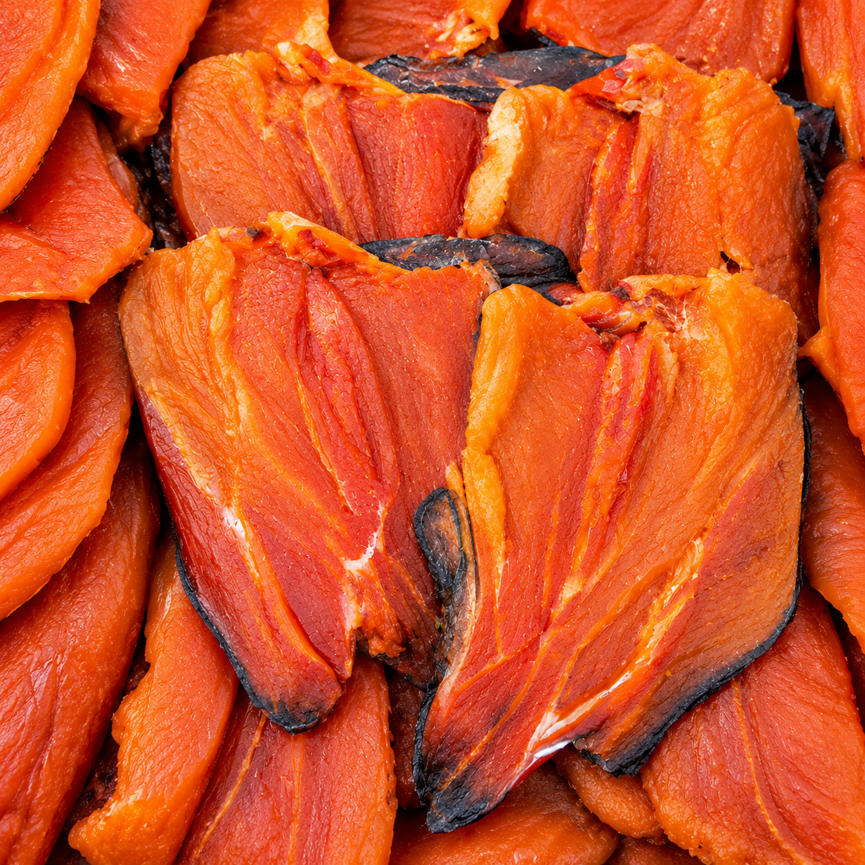 Dried salmon pieces with rich orange-red color and natural texture