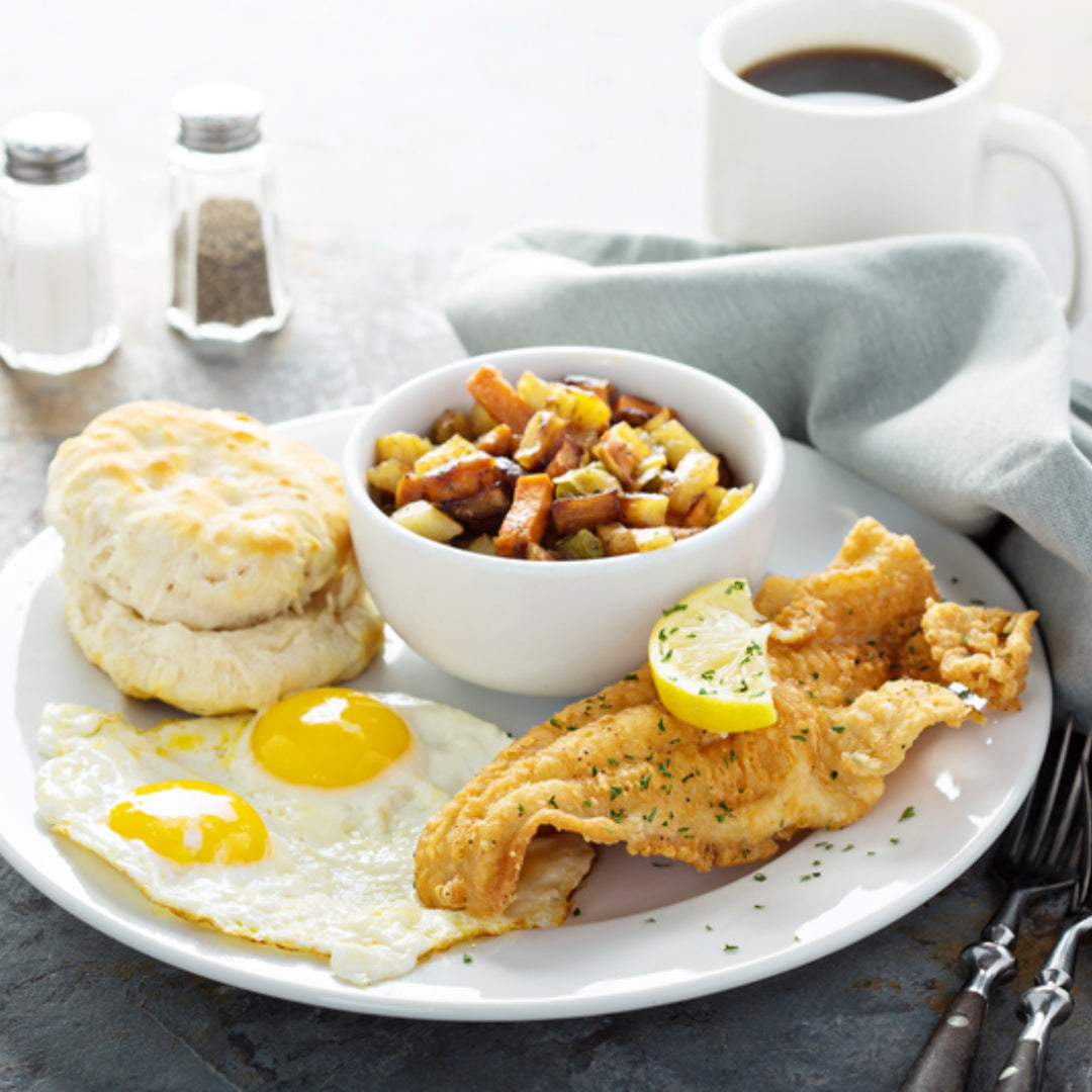 A smoked salmon breakfast spread with lox, cream cheese, capers, red onion, and bagels — the most popular seafood breakfast in the world
