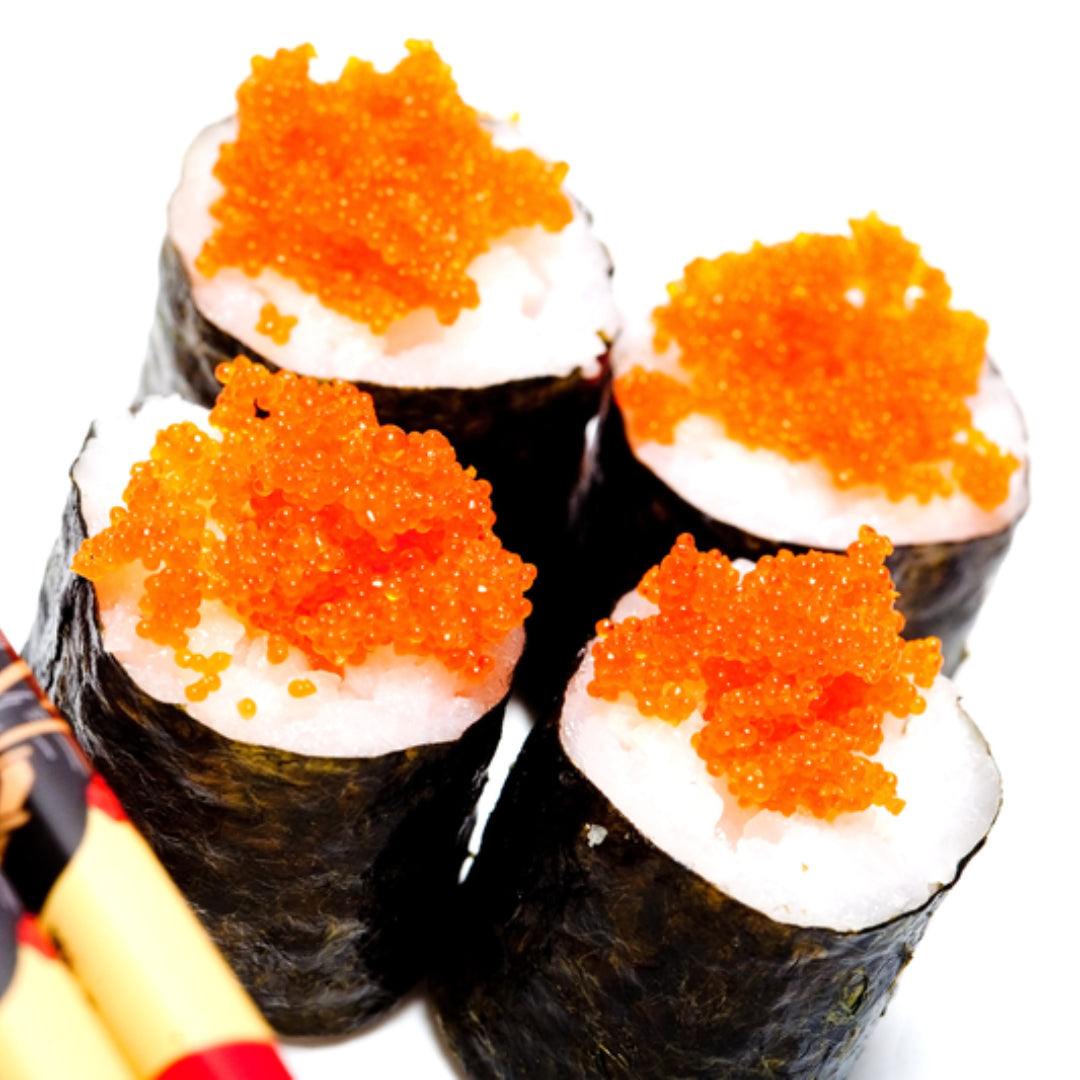 Ikura sushi (salmon roe nigiri) — bright orange salmon roe pearls on seasoned sushi rice wrapped with a thin strip of nori, one of the most visually striking and flavorful sushi preparations