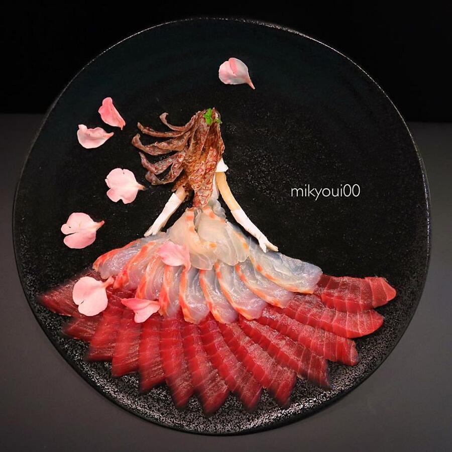 A beautifully plated sashimi assortment featuring thinly sliced tuna, salmon, yellowtail, and octopus arranged with daikon radish, shiso leaves, and wasabi — the purest expression of Japanese seafood cuisine