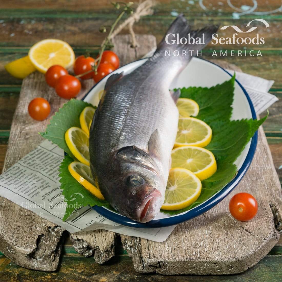 Whole grilled Branzino with crispy golden skin, stuffed with walnuts and pomegranate seeds, garnished with fresh herbs and lemon slices